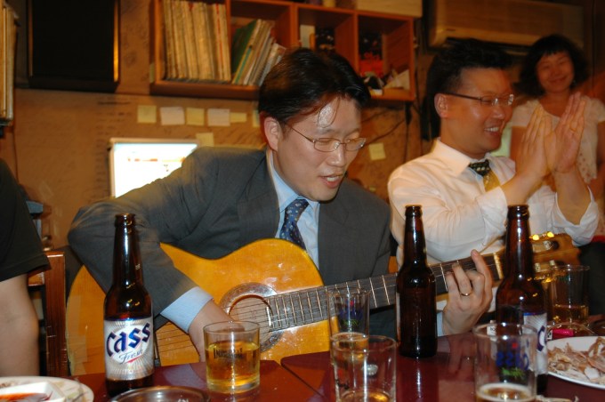 Korean Businessman Playing Guitar